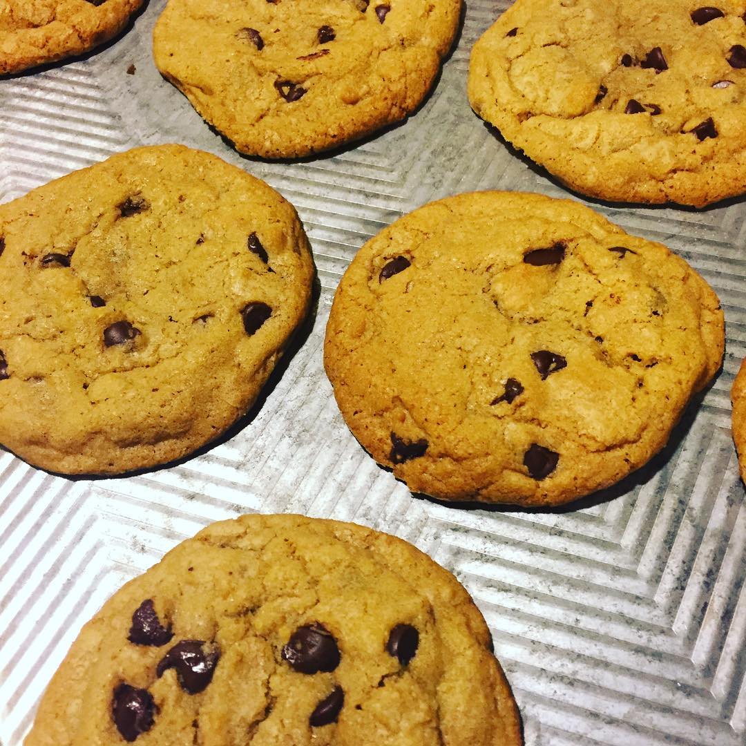 Chocolate chip cookies on a silver cookie sheet